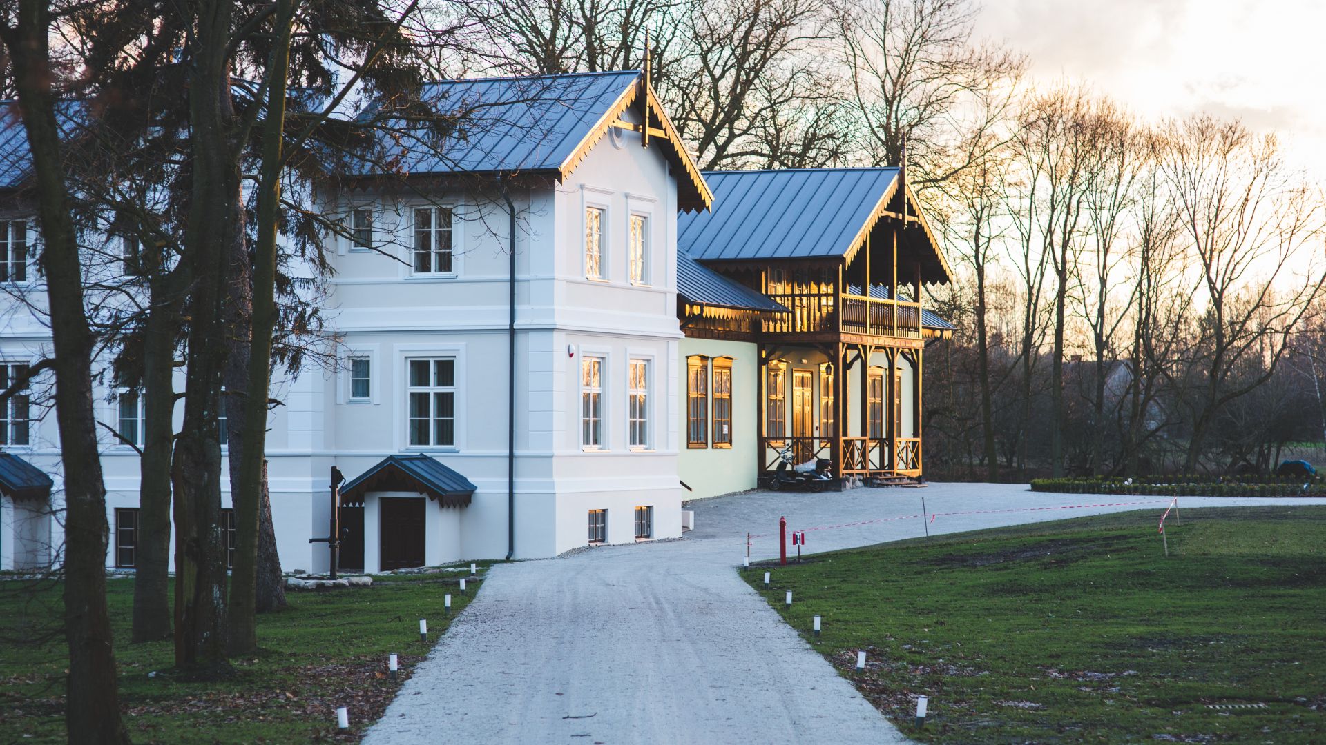 A large white house with a blue roof