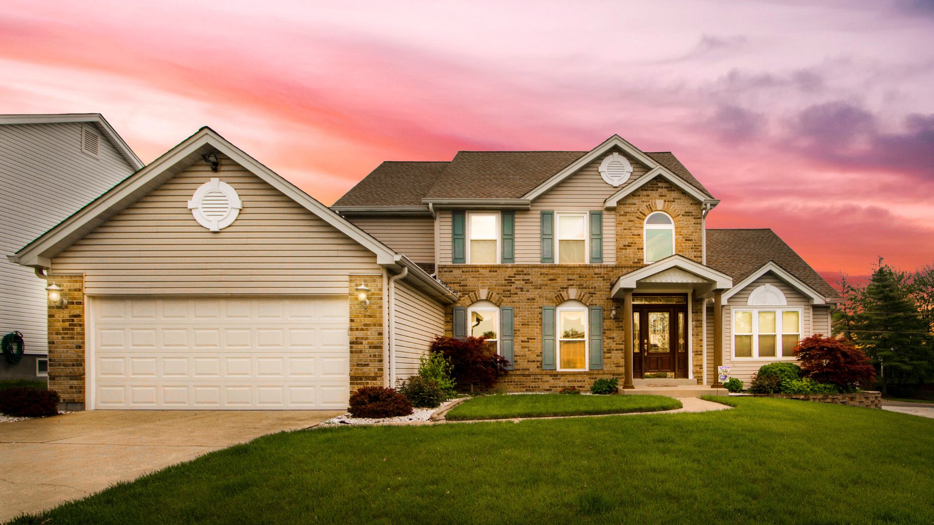 A house with a beautiful sunset in the background